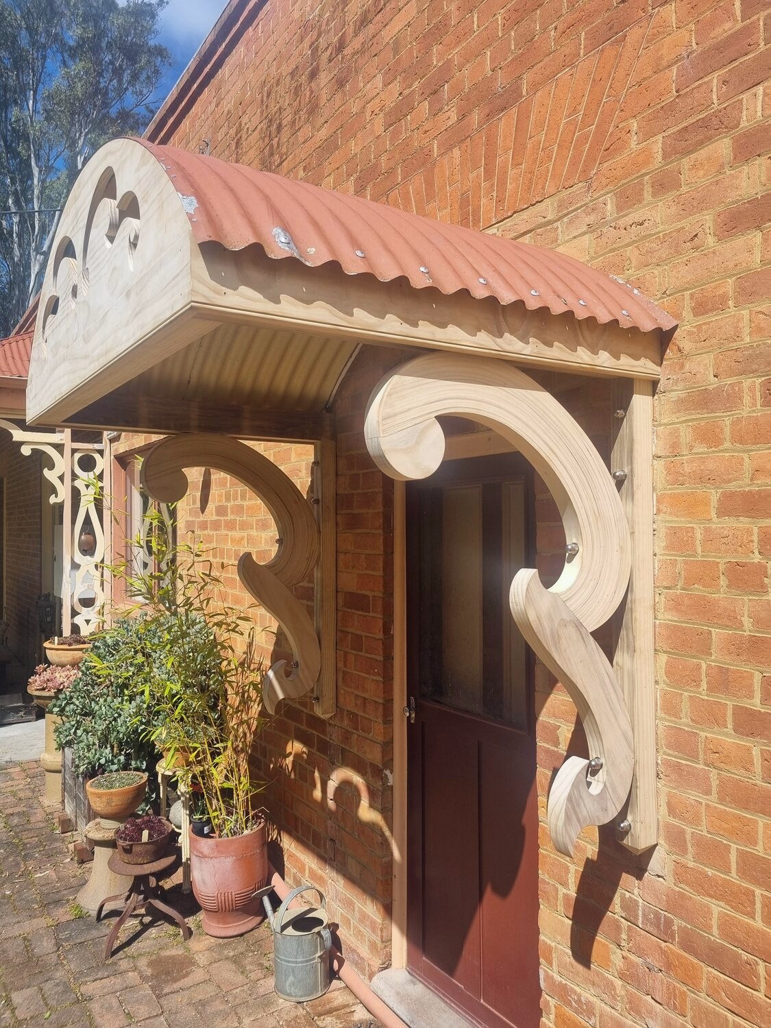 Ornate timber door hood over an entrance