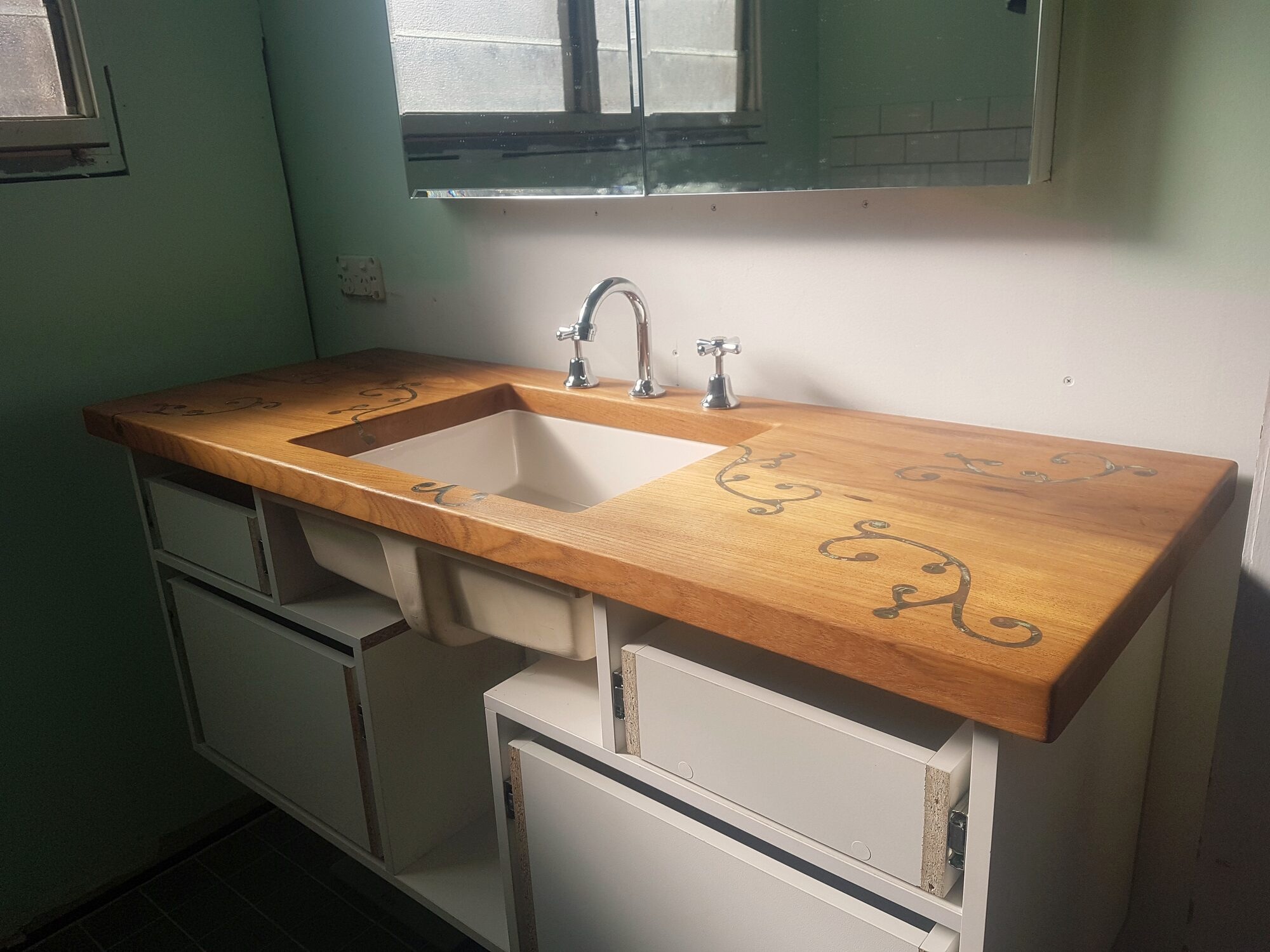 Timber benchtop and vanity joinery in a bathroom