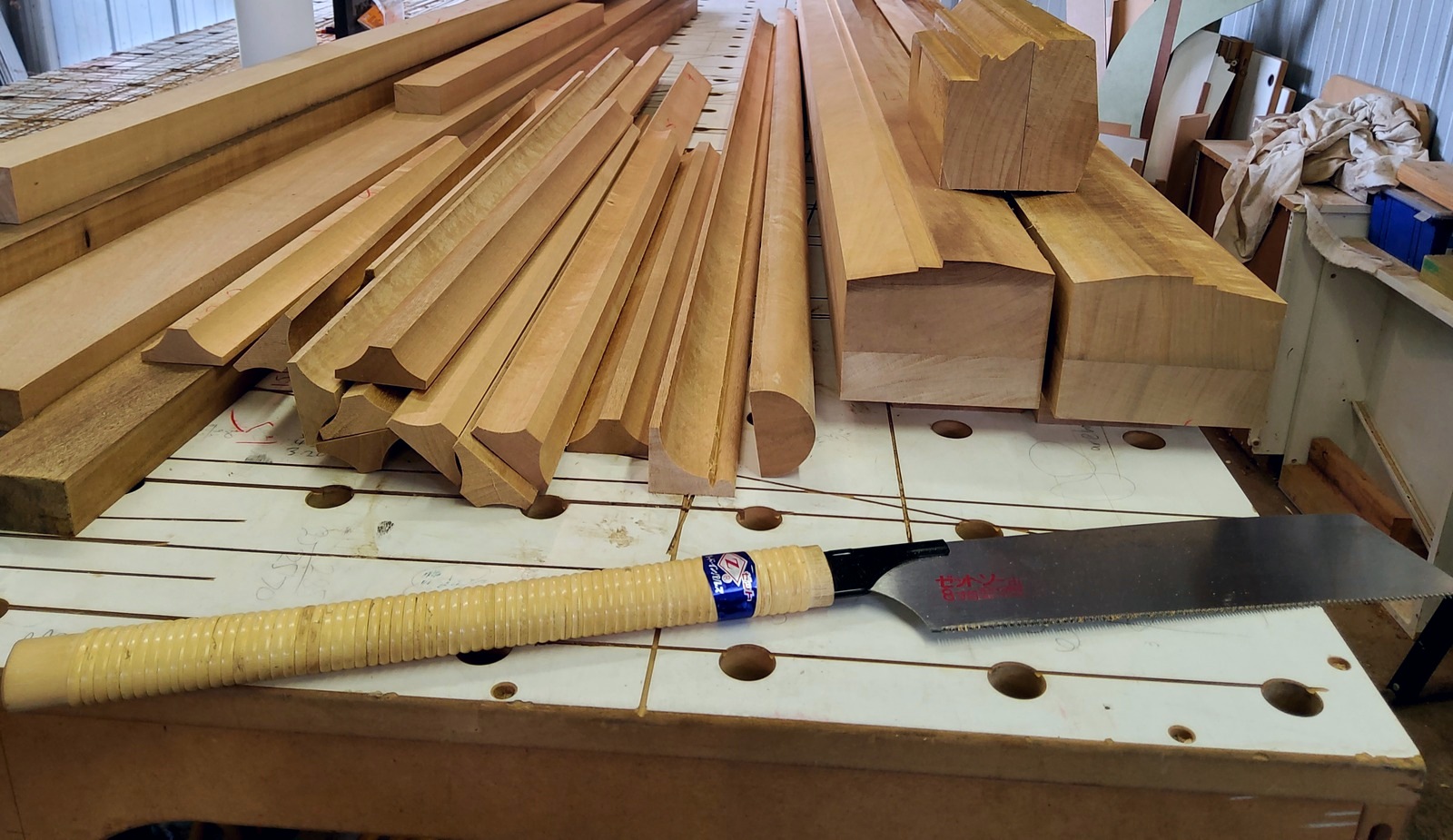Freshly machined timber mouldings on the workshop bench